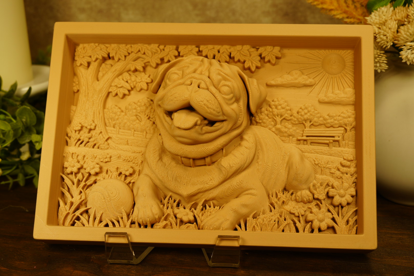 Handcrafted photo relief frame of a bulldog resting in a carved park scene